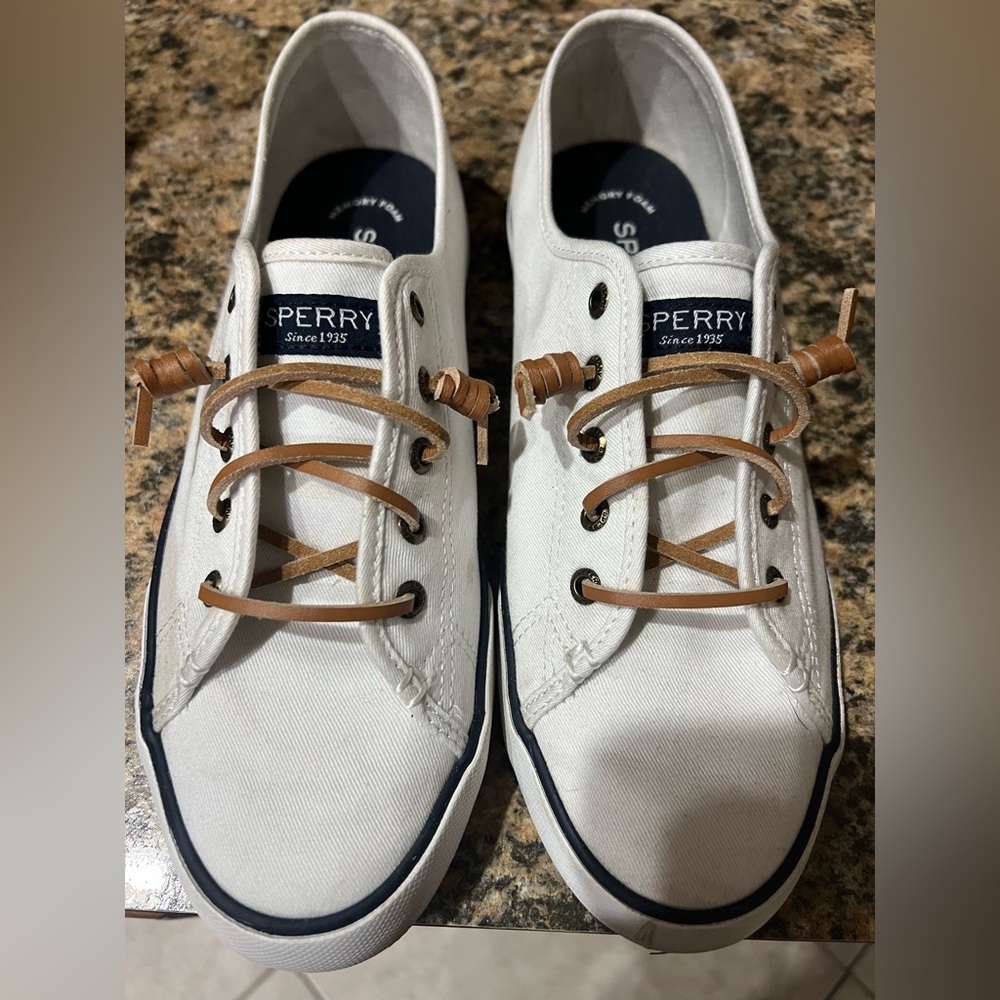 Sperry Pier View Core white shoes with brown leather laces.